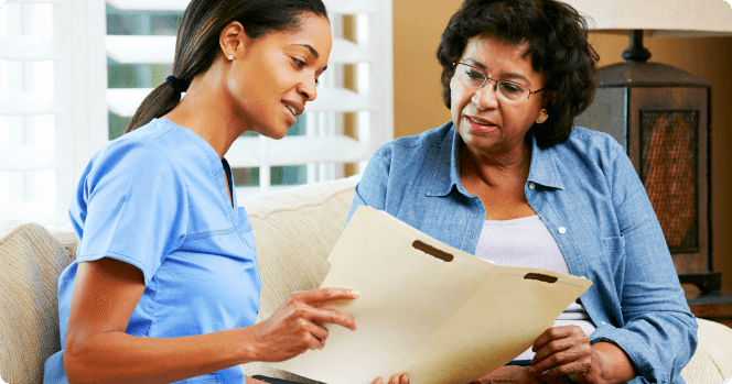 Nurse showing a document to a senior